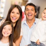 Portrait of happy family in a clothing store smiling___serialized3